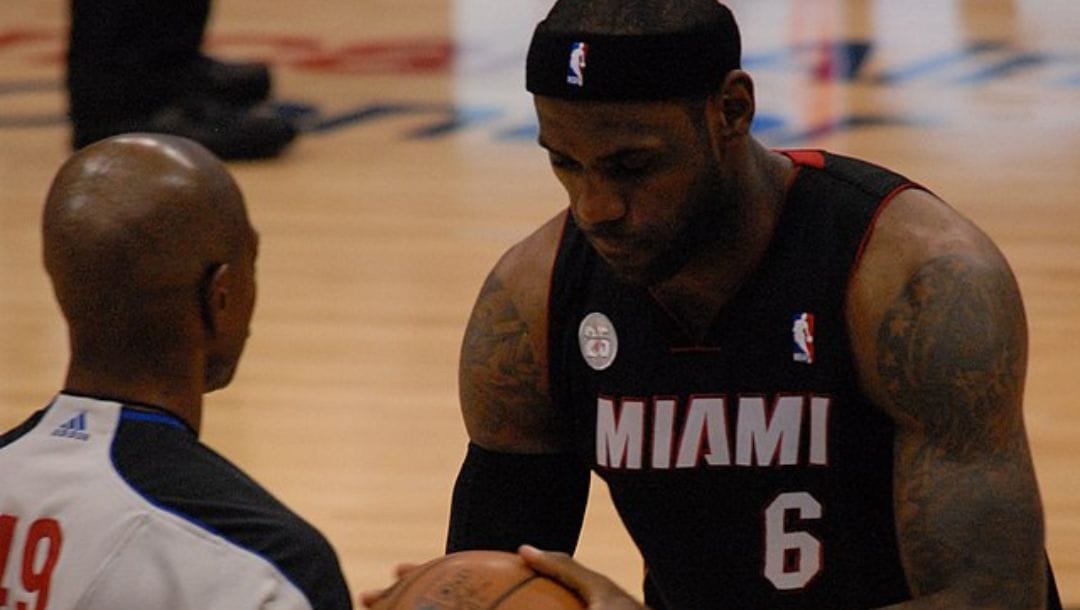 LeBron James of the Miami Heat with a game official during their game against the Dallas Mavericks in December 2012.