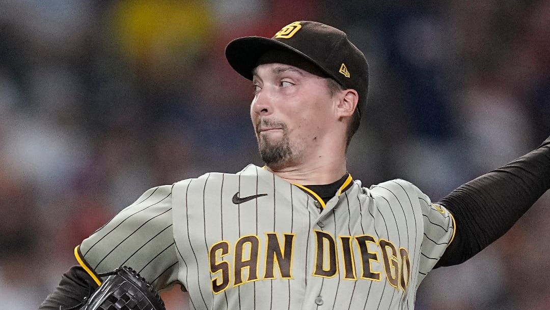 San Diego Padres starting pitcher Blake Snell delivers during the first inning of a baseball game against the Houston Astros, Friday, Sept. 8, 2023, in Houston. (AP Photo/Kevin M. Cox)
