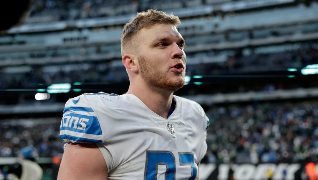 Detroit Lions defensive end Aidan Hutchinson (97) walks off the field after defeating the New York Jets during an NFL football game Sunday, Dec. 18, 2022, in East Rutherford, N.J. (AP Photo/Adam Hunger)