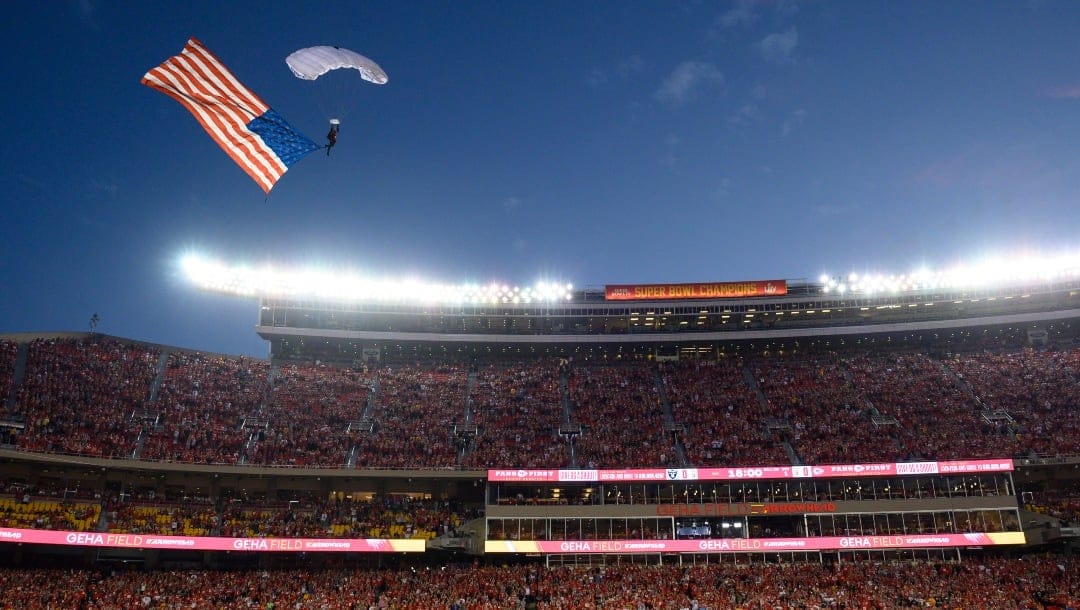 A parachutist from the U.S. Air Force landed with a U.S. flag on GEHA Field at Arrowhead Stadium prior to the start of an NFL football game between the Kansas City Chiefs and the Las Vegas Raiders, Monday, Oct. 10, 2022 in Kansas City, Mo. (AP Photo/Reed Hoffmann)