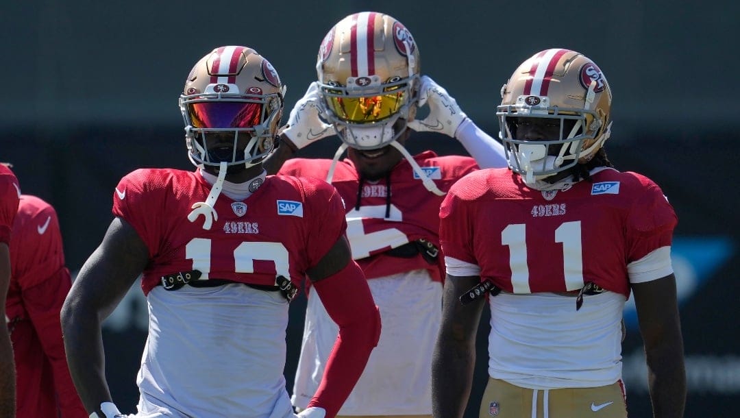 San Francisco 49ers wide receivers Deebo Samuel, left, Danny Gray, middle, and Brandon Aiyuk (11) take part in drills during the NFL team's football training camp in Santa Clara, Calif., Tuesday, Aug. 1, 2023. (AP Photo/Jeff Chiu)