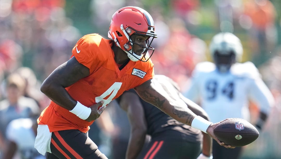 Cleveland Browns quarterback Deshaun Watson goes for the ball during an NFL football camp, Sunday, Aug. 20, 2023, in Berea, Ohio. (AP Photo/Sue Ogrocki)