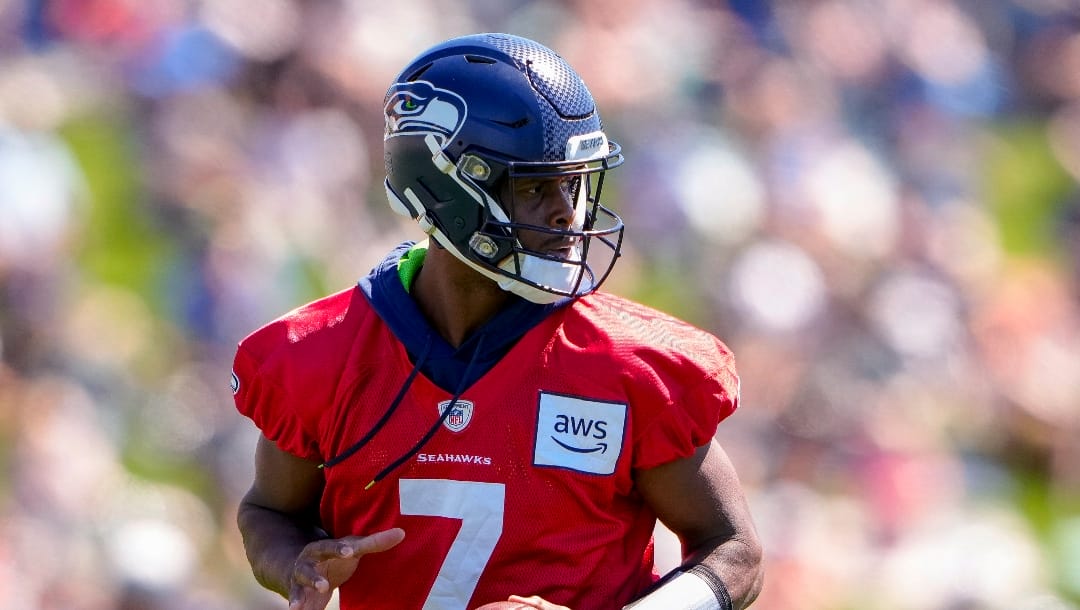 Seattle Seahawks quarterback Geno Smith drops back to pass during the NFL football team's training camp Thursday, Aug. 3, 2023, in Renton, Wash. (AP Photo/Lindsey Wasson)