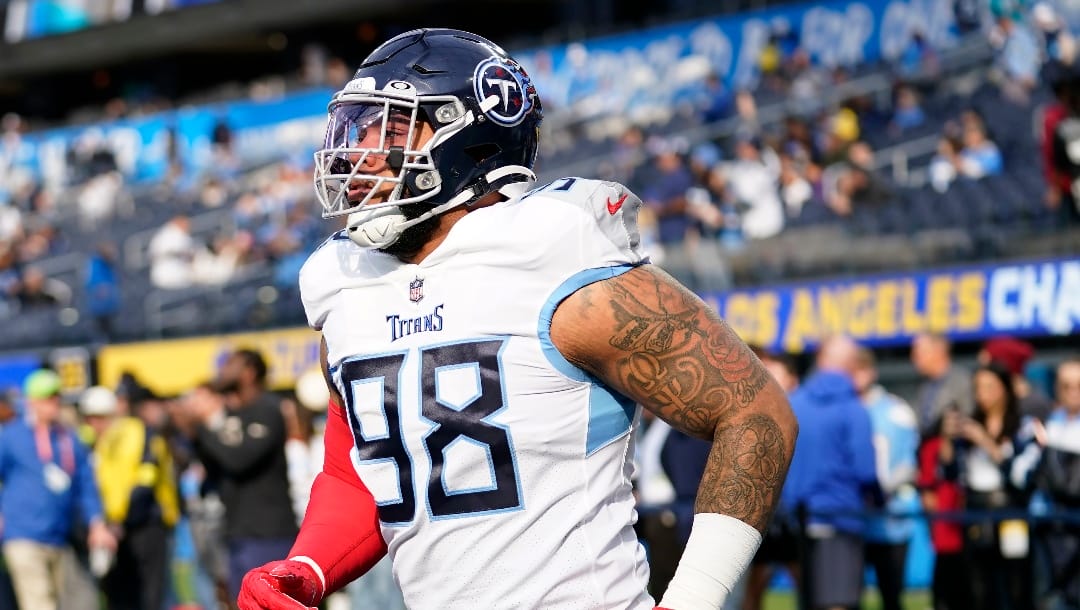 Tennessee Titans defensive tackle Jeffery Simmons (98) warms up before an NFL football game against the Los Angeles Chargers in Inglewood, Calif., Sunday, Dec. 18, 2022. (AP Photo/Ashley Landis)