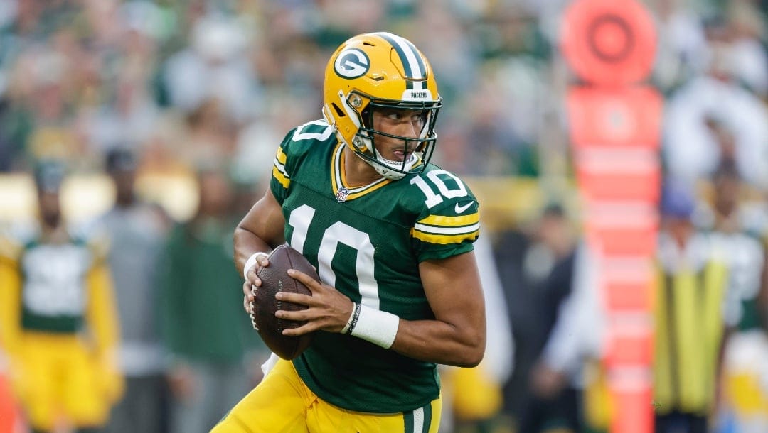 Green Bay Packers quarterback Jordan Love (10) looks to pass during a preseason NFL football game between the New England Patriots and Green Bay Packers Saturday, Aug. 19, 2023, in Green Bay, Wis. (AP Photo/Matt Ludtke)