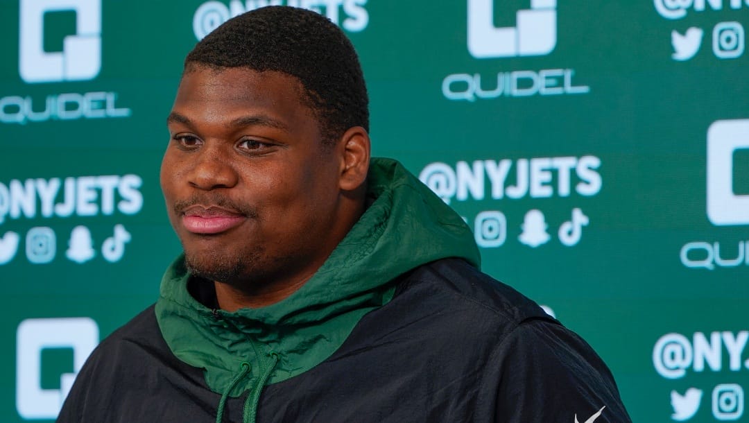 FILE - New York Jets' Quinnen Williams speaks to reporters after a practice at the NFL football team's training facility in Florham Park, N.J., May 24, 2022. Williams and the Jets have agreed, Thursday, July 13, 2023, to a four-year contract extension worth $96 million, according to a person with knowledge of the deal. (AP Photo/Seth Wenig, File)