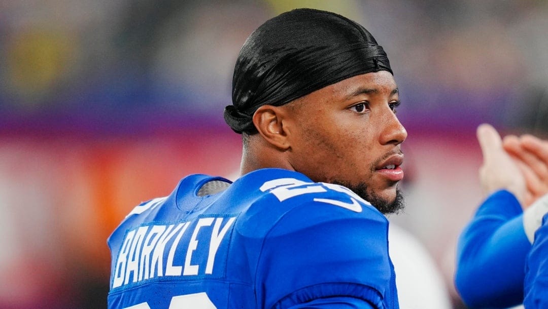 New York Giants running back Saquon Barkley (26) walks the sidelines during an NFL pre-season football game against the Carolina Panthers on Friday, Aug. 18, 2023, in East Rutherford, N.J.