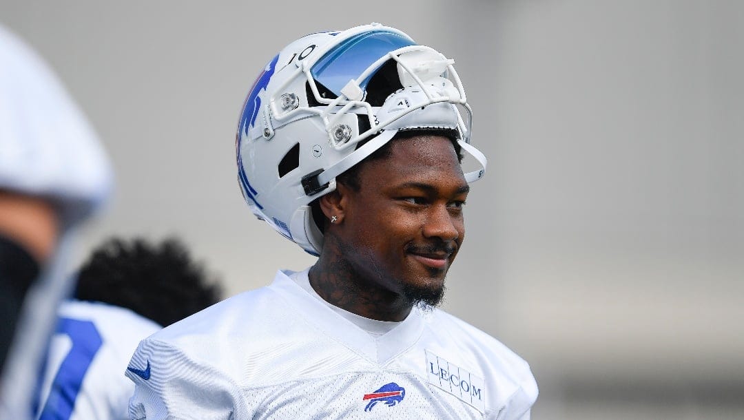 Buffalo Bills wide receiver Stefon Diggs (14) watches drills during practice at the NFL football team's training camp in Pittsford, N.Y., Wednesday, July 26, 2023. (AP Photo/Adrian Kraus)