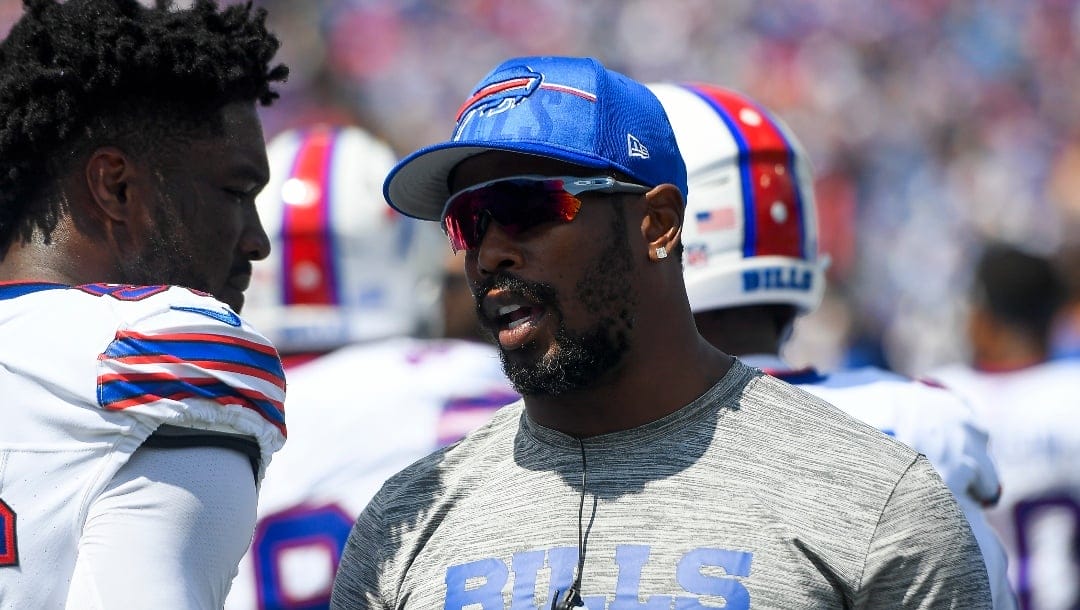 Buffalo Bills linebacker Von Miller, right, talks to defensive end Leonard Floyd during the first half an NFL preseason football game against the Indianapolis Colts in Orchard Park, N.Y., Saturday, Aug. 12, 2023. (AP Photo/Adrian Kraus)