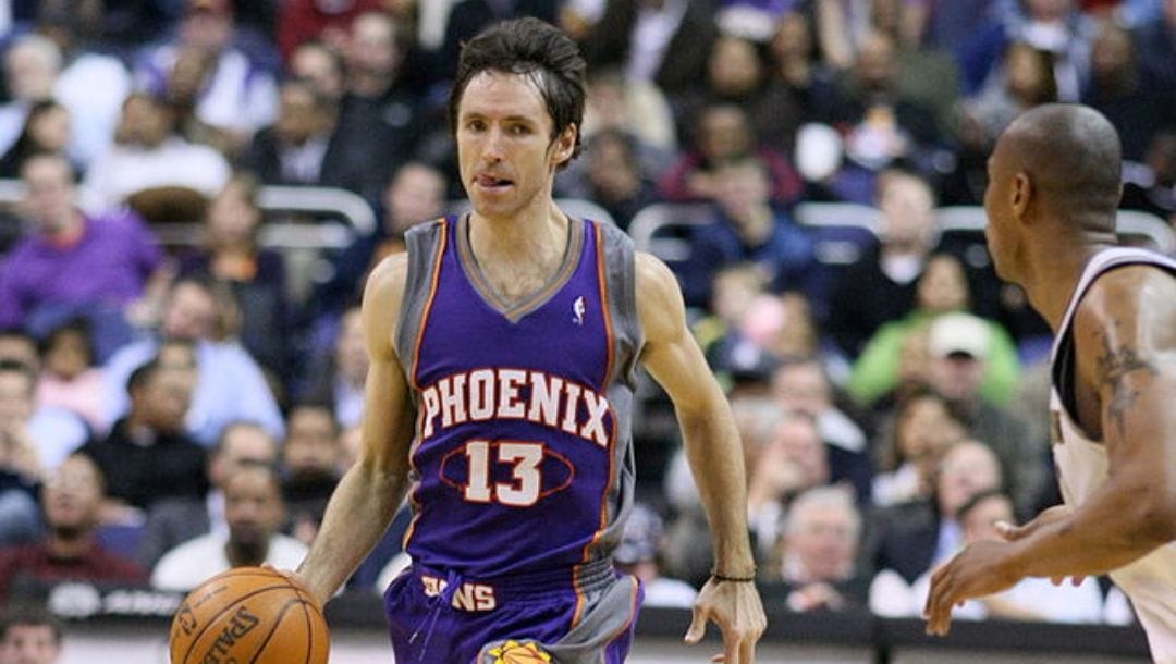 Steve Nash of the Phoenix Suns dribbles the ball against Caron Butler during an NBA game in January 2009.