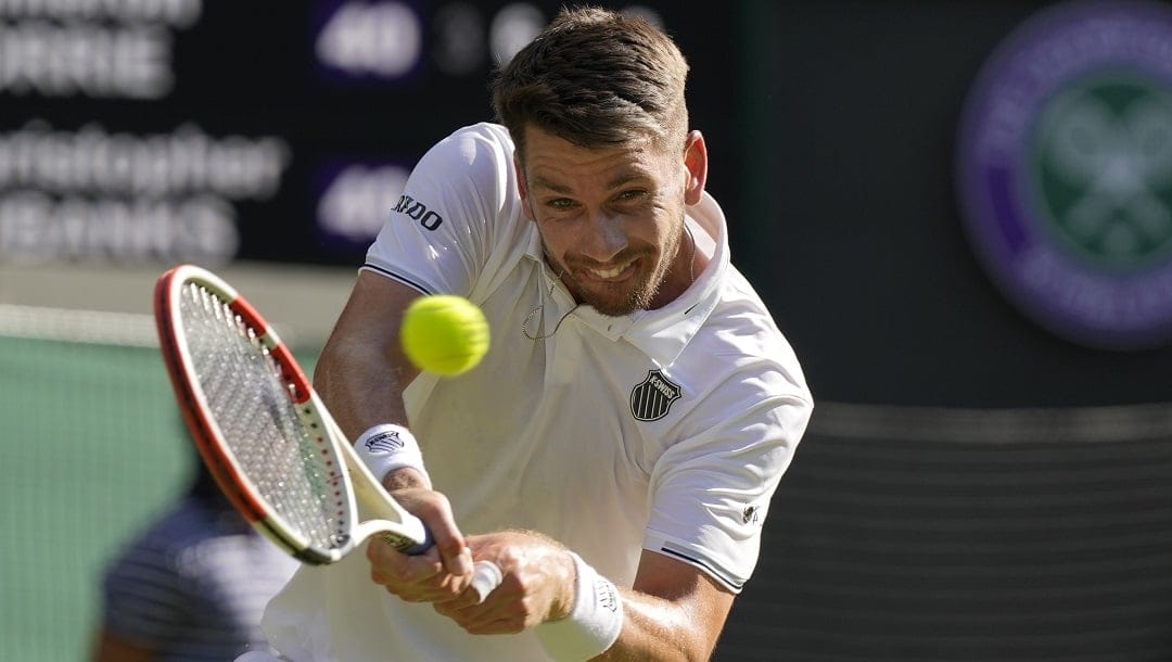 Britain's Cameron Norrie plays a return to Christopher Eubanks of the US during the men's singles match on day five of the Wimbledon tennis championships in London, Friday, July 7, 2023.