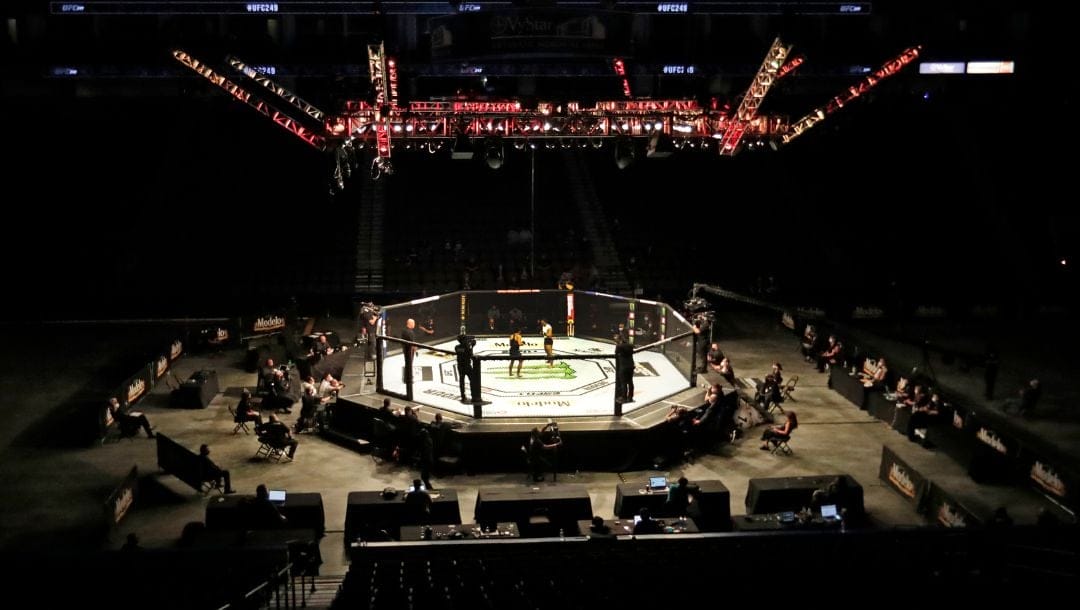 Fighters compete without fans because of the coronavirus pandemic during a UFC 249 mixed martial arts bout Saturday, May 9, 2020.