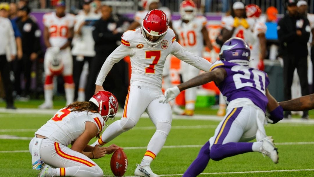 Kansas City Chiefs place kicker Harrison Butker (7) kicks a field goal during the first half of an NFL football game against the Minnesota Vikings, Sunday, Oct. 8, 2023, in Minneapolis.