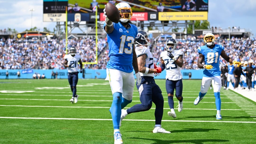 Los Angeles Chargers wide receiver Keenan Allen (13) celebrates his touchdown catch during the second half of an NFL football game against the Tennessee Titans Sunday, Sept. 17, 2023, in Nashville, Tenn.