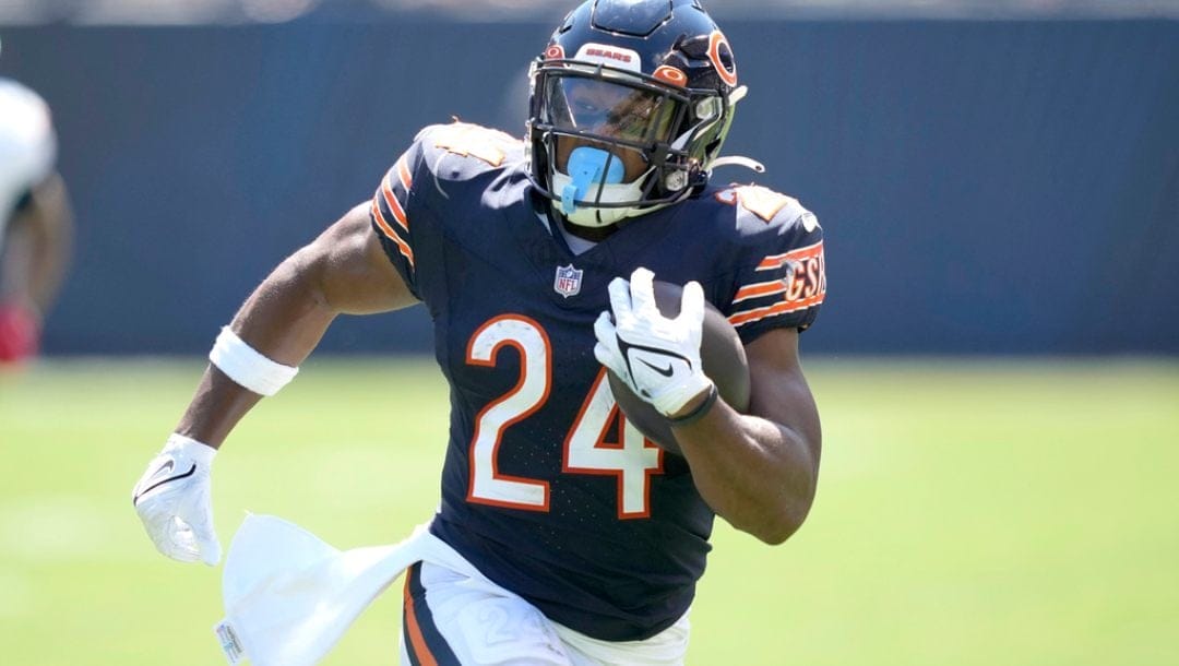 Chicago Bears' Khalil Herbert heads to the end zone for a touchdown in an NFL preseason football game against the Tennessee Titans Saturday, August 12, 2023, in Chicago.