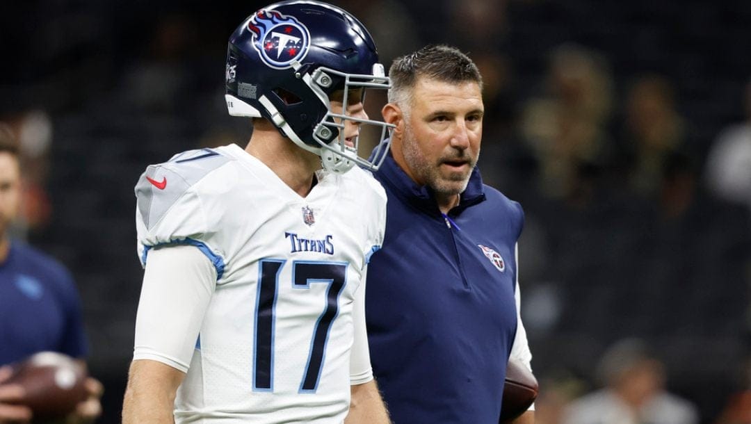 Tennessee Titans head coach Mike Vrabel talks with quarterback Ryan Tannehill (17) before an NFL football game against the New Orleans Saints in New Orleans, Sunday, Sept. 10, 2023.