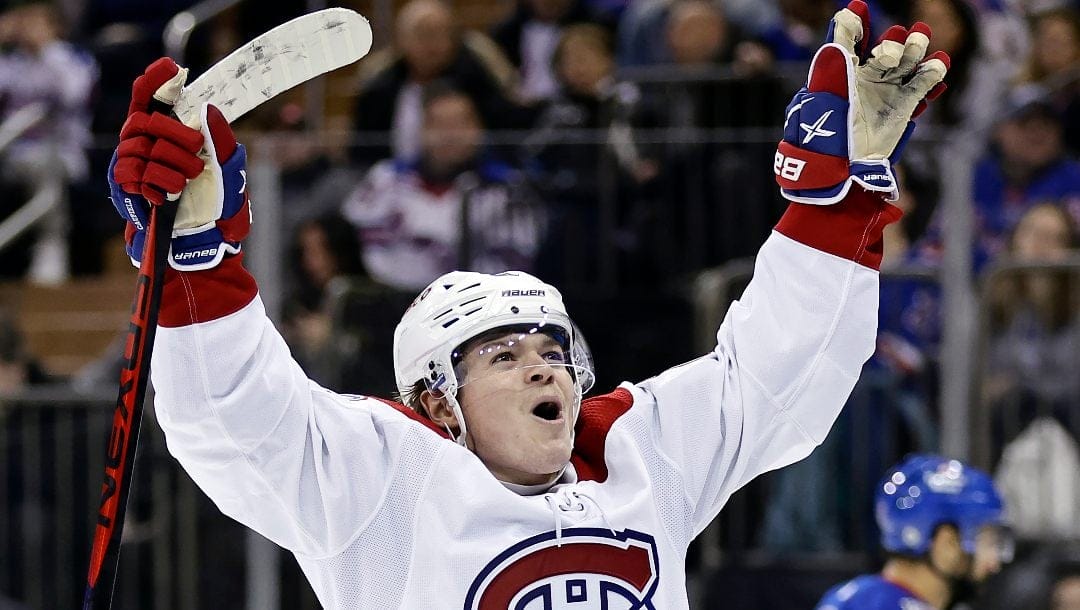 Montreal Canadiens right wing Cole Caufield reacts after scoring a goal against the New York Rangers in the third period of an NHL hockey game Sunday, Jan. 15, 2023, in New York. The Canadiens have signed Caufield to eight-year contract extension on Monday, June 5, 2023. The deal, which will pay the 22-year-old winger an average annual salary of $7.85 million, runs through the 2030-31 season.