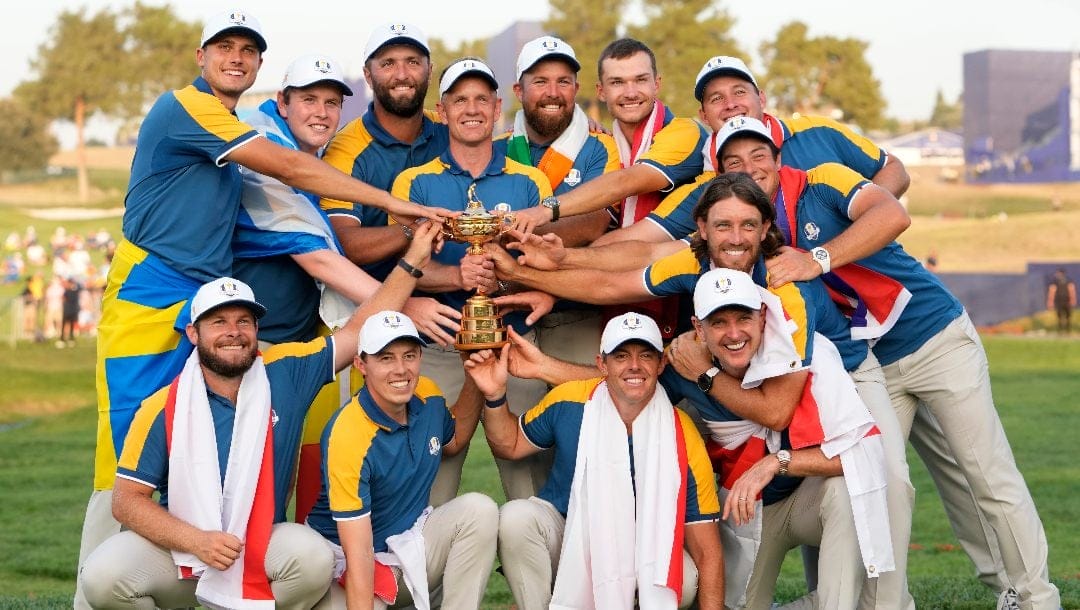 Europe's Team Captain Luke Donald , centre, and team members lift the Ryder Cup after winning the trophy by defeating the United States 16/12 point to 11 1/2 points at the Marco Simone Golf Club in Guidonia Montecelio, Italy, Sunday, Oct. 1, 2023.
