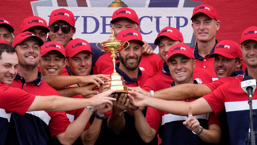Team USA players and captains pose with the trophy after the Ryder Cup matches at the Whistling Straits Golf Course Sunday, Sept. 26, 2021, in Sheboygan, Wis. The Americans will try to win for the second straight time outside Rome when the matches start Friday, Sept. 29.