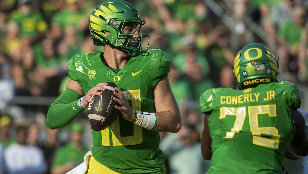 Oregon quarterback Bo Nix (10) passes against Hawaii during the first half of an NCAA college football game Saturday, Sept. 16, 2023, in Eugene, Ore.