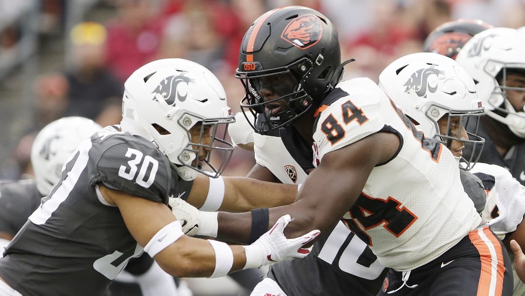 Oregon State tight end Jermaine Terry II (84) blocks Washington State defensive back Jackson Lataimua (30) during the first half of an NCAA college football game, Saturday, Sept. 23, 2023, in Pullman, Wash.