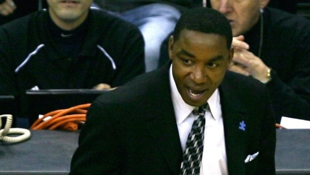 Isiah Thomas talking with a referee as a head coach during an NBA game in January 2007.