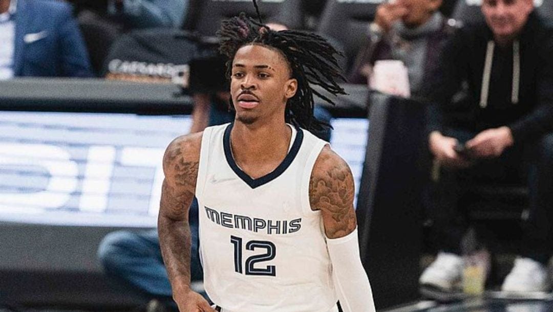 Ja Morant of the Memphis Grizzlies brings down the ball during an NBA game in November 2021.