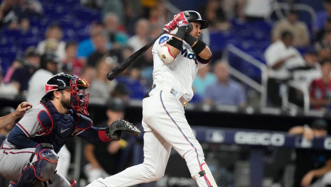 Miami Marlins' Luis Arraez (3) hits a single during a baseball game Atlanta Braves, Sunday, Sept. 17, 2023, in Miami.