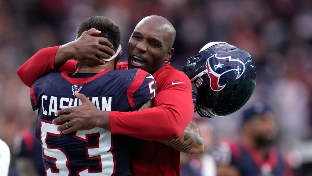 Houston Texans linebacker Blake Cashman (53) hugs head coach Demeco Ryans after a win over the Denver Broncos in an NFL football game Sunday, Dec. 3, 2023, in Houston. (AP Photo/Eric Christian Smith)