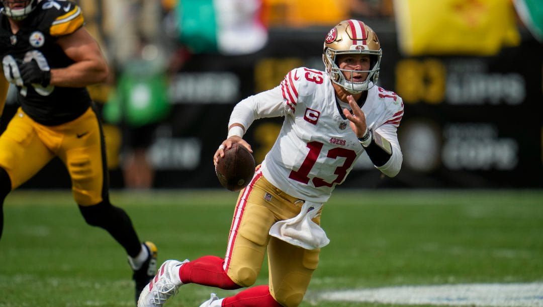 San Francisco 49ers quarterback Brock Purdy (13) runs with the ball against the Pittsburgh Steelers during the second half of an NFL football game, Sunday, Sept. 10, 2023, in Pittsburgh.