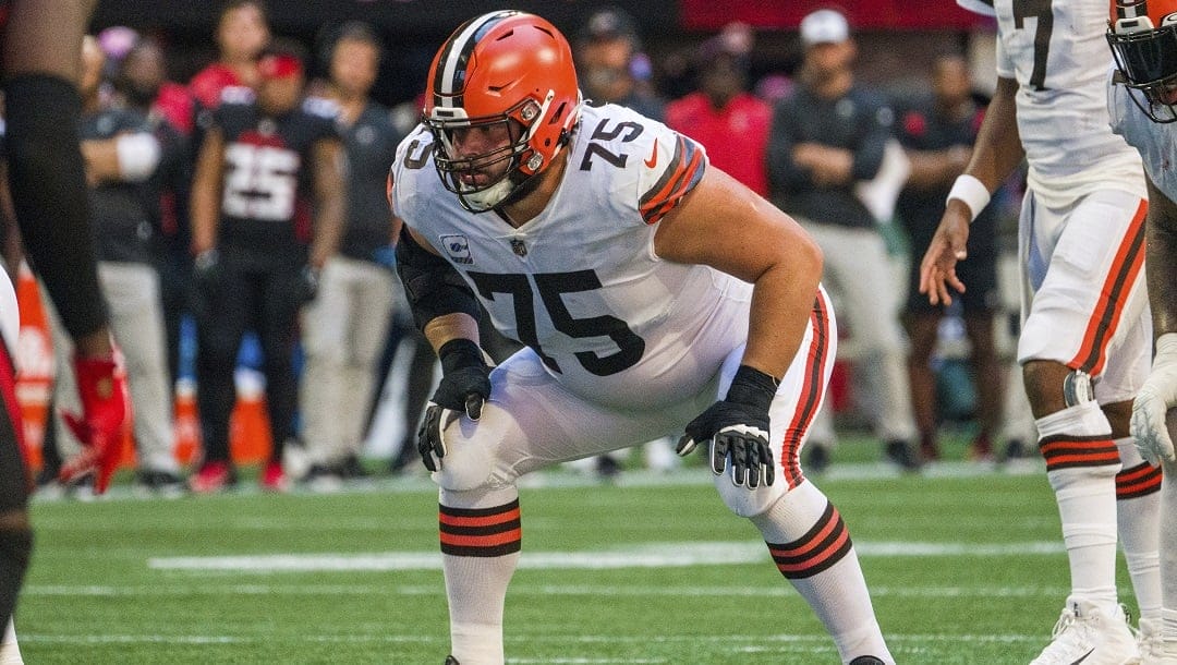 Cleveland Browns guard Joel Bitonio (75) lines up during the first half of the team's NFL football game against the Atlanta Falcons, Oct. 2, 2022, in Atlanta. Bitonio has been one of the league's most consistent blockers, earning a second-team All-Pro spot for three straight seasons from 2018-20 and first-team honors the past two seasons.