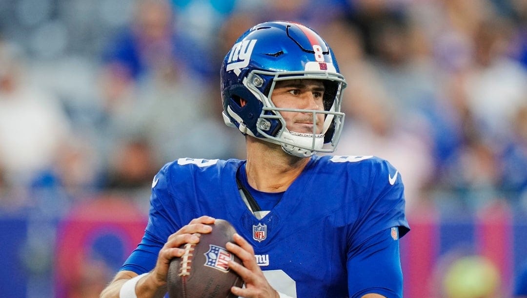 New York Giants quarterback Daniel Jones (8) passes during an NFL pre-season football game against the Carolina Panthers on Friday, Aug. 18, 2023, in East Rutherford, N.J.