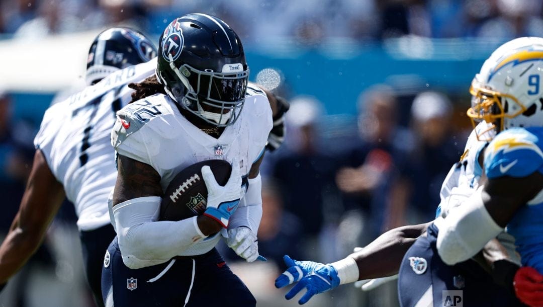 Tennessee Titans running back Derrick Henry (22) runs for yardage during their NFL football game against the Los Angeles Chargers Sunday, Sept. 17, 2023, in Nashville, Tenn.