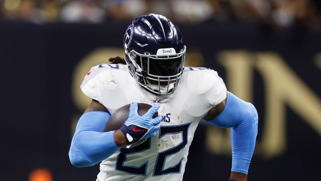 Tennessee Titans running back Derrick Henry carries the ball during the first half of an NFL football game against the New Orleans Saints Tuesday, Sept. 12, 2023, in New Orleans.