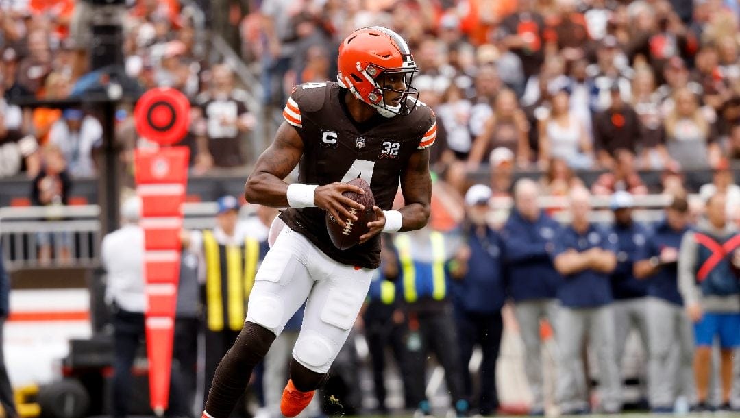 Cleveland Browns quarterback Deshaun Watson (4) runs with the ball during an NFL football game against the Tennessee Titans, Sunday, Sep. 24, 2023, in Cleveland.