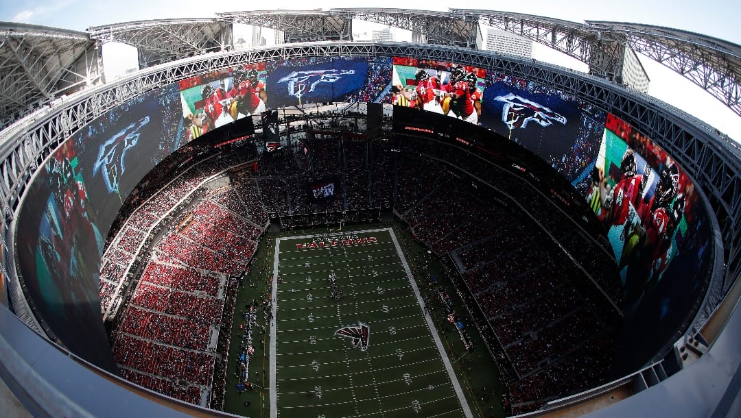 The Dallas Cowboys play the Atlanta Falcons inside the Mercedes-Benz Stadium with the roof open during the first half of an NFL football game, Sunday, Nov. 18, 2018, in Atlanta. (AP Photo/John Bazemore)