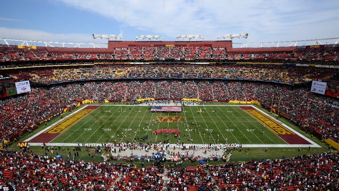FILE - FedEx Field, home of the Washington Commanders NFL football team, is shown before the start of a football game between the Philadelphia Eagles and Washington Commanders, Sunday, Sept. 25, 2022, in Landover, Md. A group led by Josh Harris and Mitchell Rales that includes Magic Johnson has an agreement in principle to buy the NFL's Washington Commanders from longtime owner Dan Snyder for a North American professional sports team record $6 billion, according to a person with knowledge of the situation. The person spoke to The Associated Press on condition of anonymity Thursday, April 13, 2023, because the deal had not been announced. (AP Photo/Nick Wass, File)