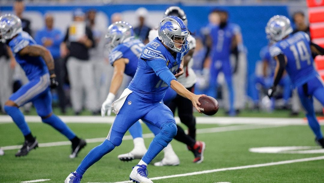 Detroit Lions quarterback Jared Goff looks to hand off during an NFL football game against the Atlanta Falcons, Sunday, Sept. 24, 2023, in Detroit.