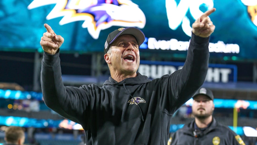Baltimore Ravens head coach John Harbaugh reacts to fans as he walks off the field after an NFL football game against the Jacksonville Jaguars, Sunday, Dec. 17, 2023, in Jacksonville, Fla. The Ravens defeated the Jaguars 23-7. (AP Photo/Gary McCullough)