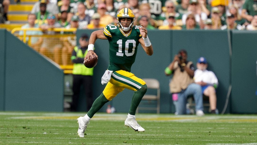 Green Bay Packers quarterback Jordan Love (10) rushes during an NFL football game between the Green Bay Packers and New Orleans Saints Sunday, Sept. 24, 2023, in Green Bay, Wis.