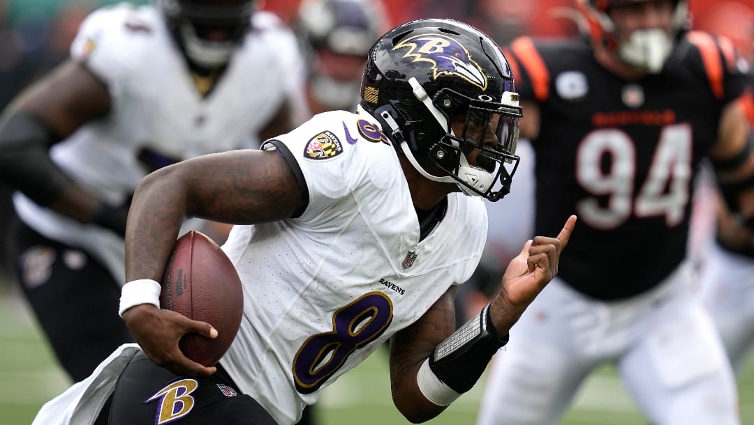 Baltimore Ravens quarterback Lamar Jackson runs with the ball during the second half of an NFL football game against the Cincinnati Bengals Sunday, Sept. 17, 2023, in Cincinnati.