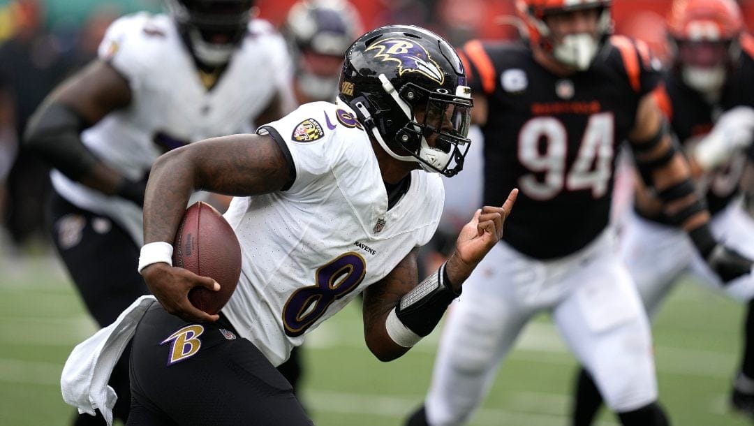 Baltimore Ravens quarterback Lamar Jackson runs with the ball during the second half of an NFL football game against the Cincinnati Bengals Sunday, Sept. 17, 2023, in Cincinnati.