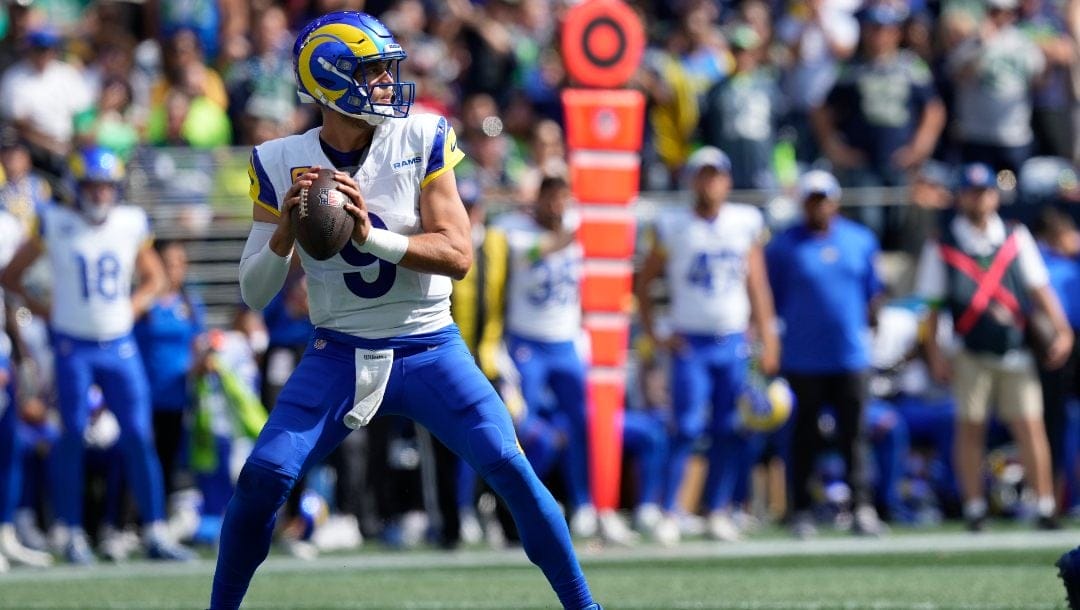 Los Angeles Rams quarterback Matthew Stafford (9) steps back to pass during an NFL football game against the Seattle Seahawks, Sunday, Sept. 10, 2023 in Seattle. The Rams won 30-13.