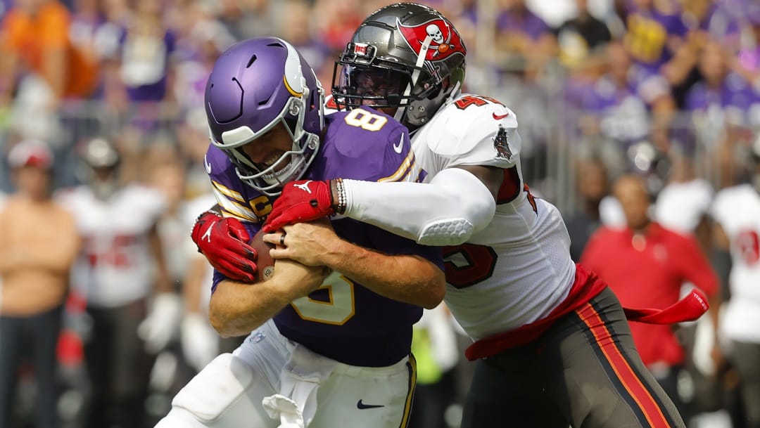 Minnesota Vikings quarterback Kirk Cousins (8) is tackled by Tampa Bay Buccaneers linebacker Devin White (45) during the second half of an NFL football game, Sunday, Sept. 10, 2023, in Minneapolis.