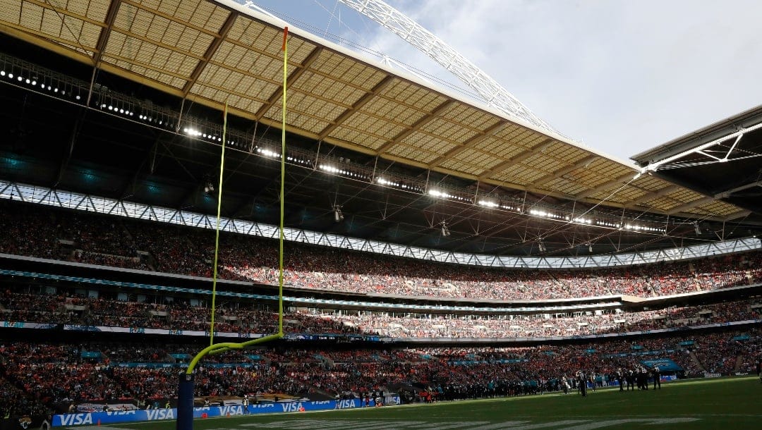 Fans watch the Jacksonville Jaguars take on the Denver Broncos during an NFL football game at Wembley Stadium in London, Sunday, Oct. 30, 2022. The Denver Broncos defeated the Jacksonville Jaguars 21-17. (AP Photo/Steve Luciano)