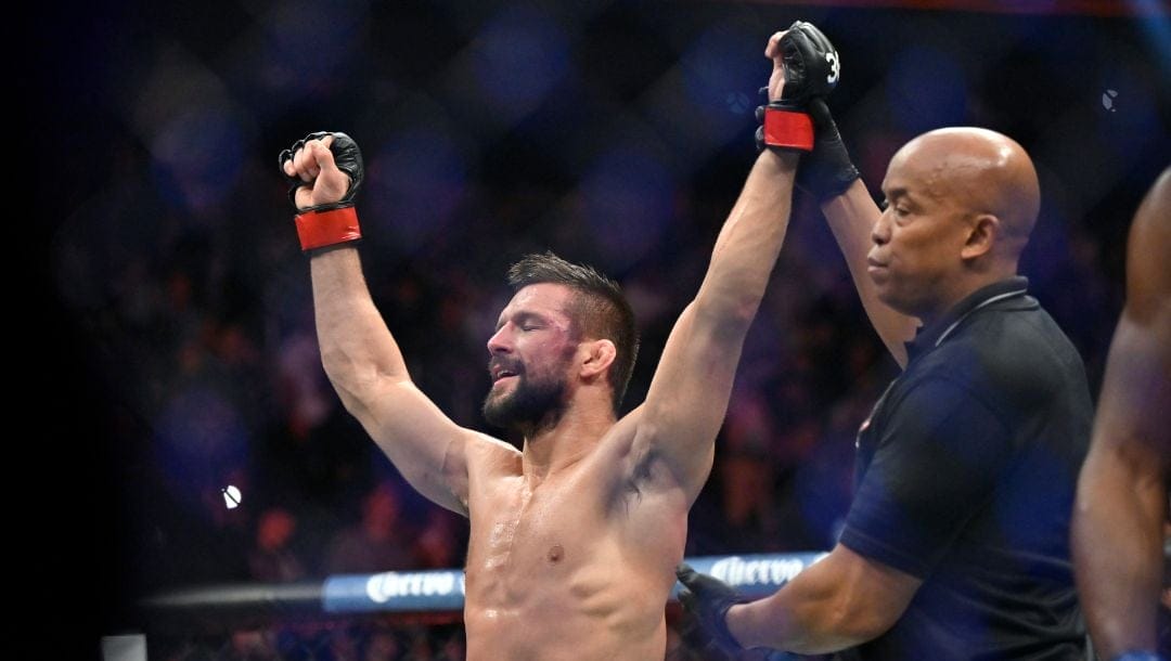 Mateusz Gamrot reacts after being declared the winner over Jalin Turner with a split decision in a UFC 285.