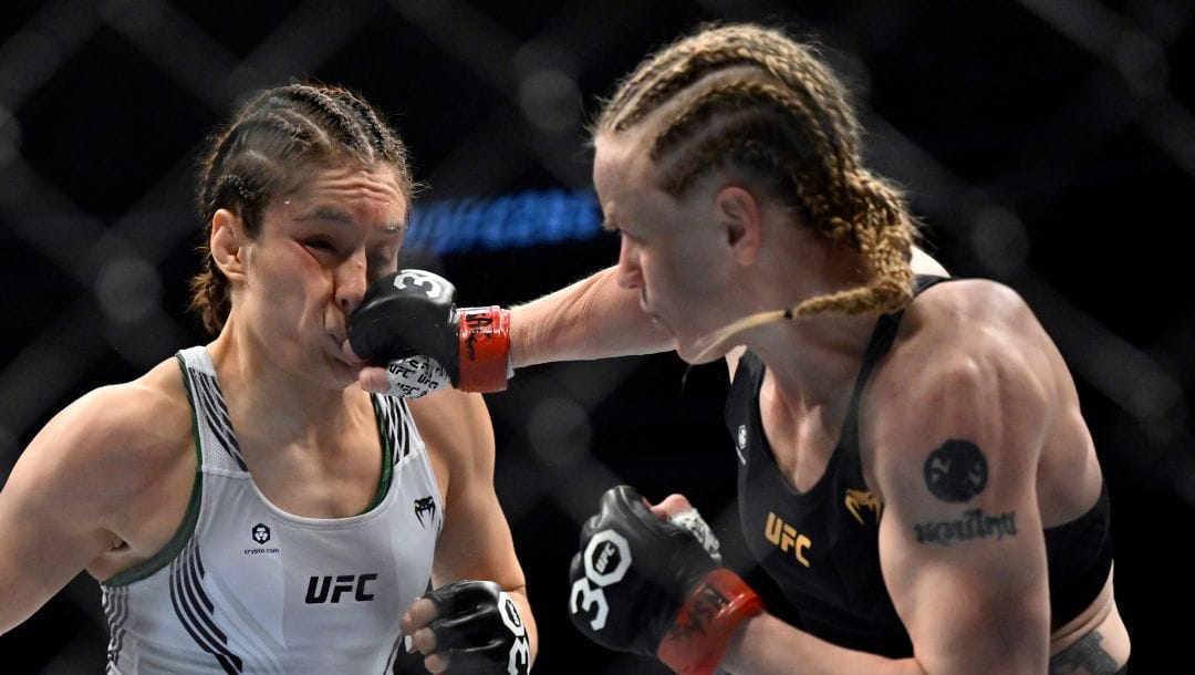 Alexa Grasso, left, is hit by Valentina Shevchenko during a UFC 285 mixed martial arts flyweight title bout Saturday.