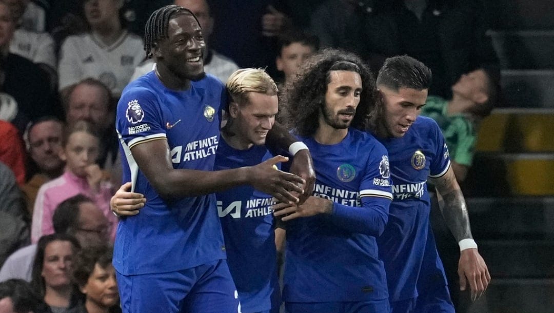 Chelsea's Mykhailo Mudryk, second left, celebrates with teammates after scoring his side's opening goal during the English Premier League soccer match between Fulham and Chelsea at Craven Cottage in London, Monday, Oct. 2, 2023.