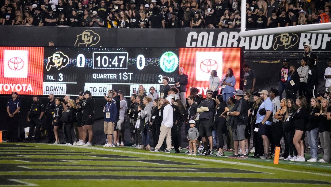 Fans crowd the southeast sideline of Folsom Field in the first half of an NCAA college football game Saturday, Sept. 16, 2023, in Boulder, Colo.