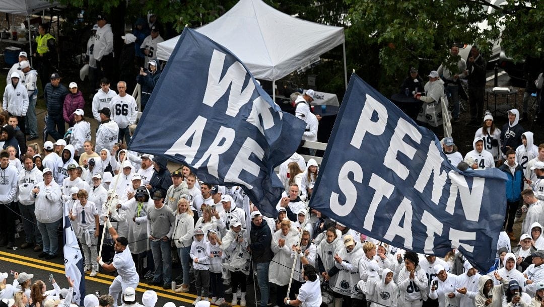 Penn State fans wait for the Nittany Lions to arrive for an NCAA college football game against Iowa amidst a "Whiteout" crowd at Beaver Stadium, Saturday, Sept. 23, 2023, in State College, Pa.